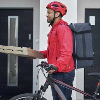 Deliverer of pizza with bicycle, Poland, podkarpackie, Debica